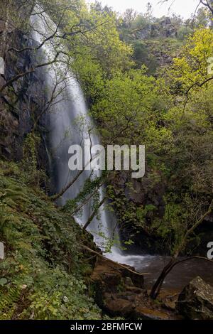 Access and environment of the Augacaida waterfall in Lugo, Galicia, Spain. Stock Photo