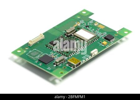 Electronic printed circuit board with chips and other components, front side, angled view, isolated on white Stock Photo