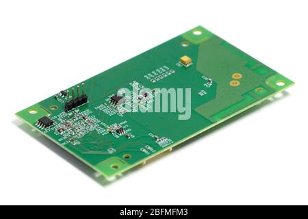 Electronic printed circuit board with chips and other components, back side, angled view, isolated on white Stock Photo