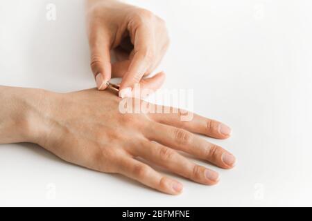 Coronavirus crisis. Future chipization of population. Implantation of microchip in hand. Medical health control of citizens. Stock Photo