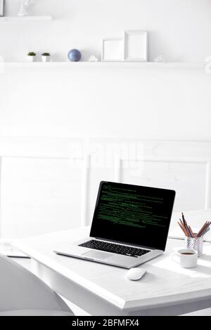 Programming code on laptop monitor Stock Photo