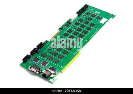 Electronic printed circuit board with microchip and many electrical components Stock Photo