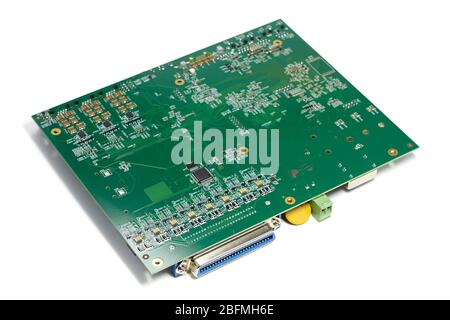 Electronic printed circuit board with microchip and many electrical components Stock Photo