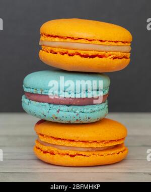 Macaroon orange and blue sweet dessert french cuisine style for coffee break Stock Photo