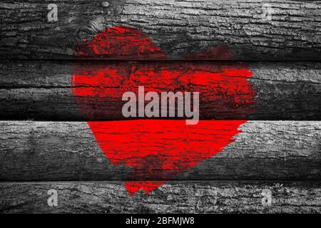 Red heart painted on old wooden wall background Stock Photo