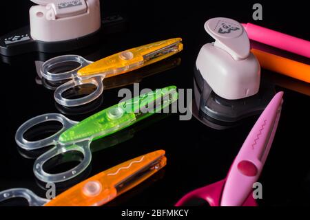 Back to school. Stationery. Scissors and markers on a black background. Creativity, handmade, study, office. Stock Photo