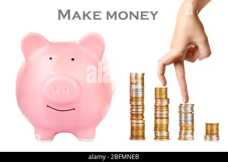 Financial success concept. Female fingers going up of coins, isolated on white Stock Photo