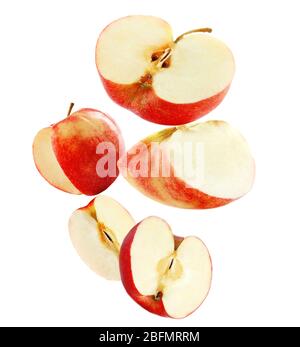 Falling ripe apples isolated on white Stock Photo