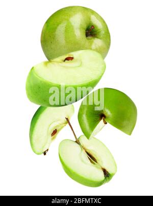 Falling ripe apples isolated on white Stock Photo