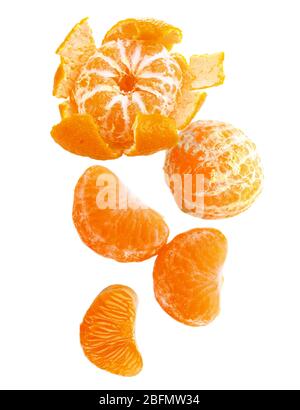 Falling tangerines isolated on white Stock Photo