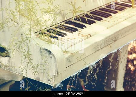 Piano fountain with plant in retro style Stock Photo