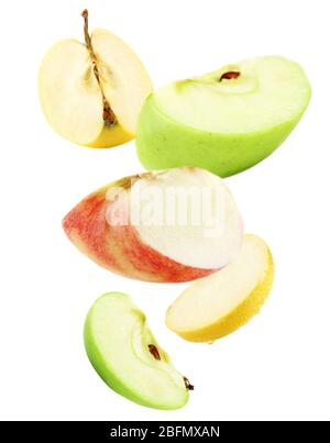 Falling ripe apples isolated on white Stock Photo