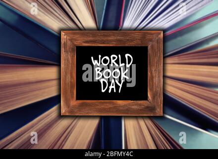 World Book Day concept. Text in frame on blurred books background Stock Photo