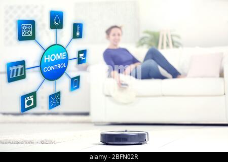 Using smart home app on phone. Smart home control concept. Stock Photo