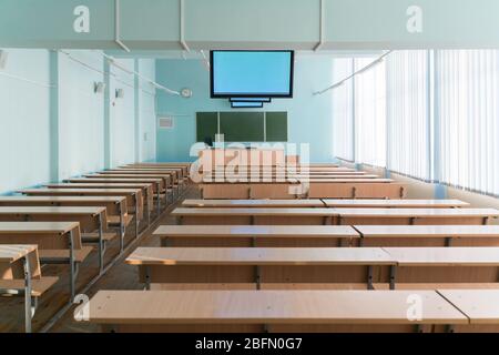 empty classroom with monitors on the ceiling for lectures at the university Stock Photo