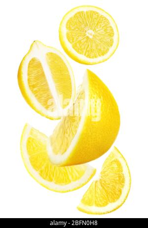 Falling ripe lemons isolated on white Stock Photo
