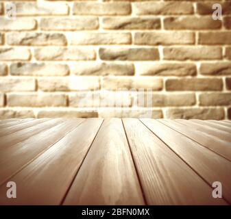 Wooden floor and brick wall background Stock Photo