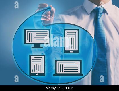 Man writing scheme with different devises Stock Photo