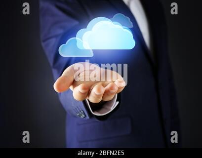Virtual clouds on hand. Cloud storage concept with copy space Stock Photo
