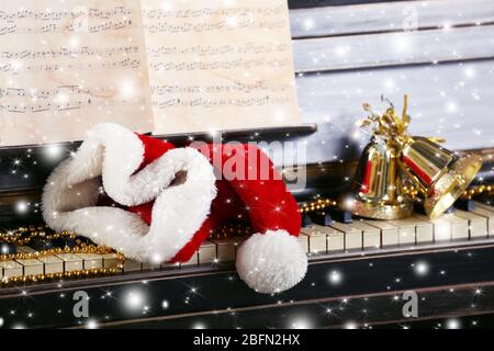 Piano keys decorated and Santa's hat with snow effect Stock Photo