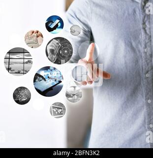 Man with preview digital business photos on virtual screen, concept of modern technology Stock Photo