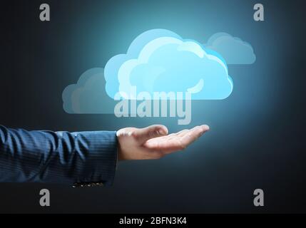 Virtual clouds on hand. Cloud storage concept with copy space Stock Photo