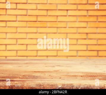 Wooden floor and brick wall background Stock Photo
