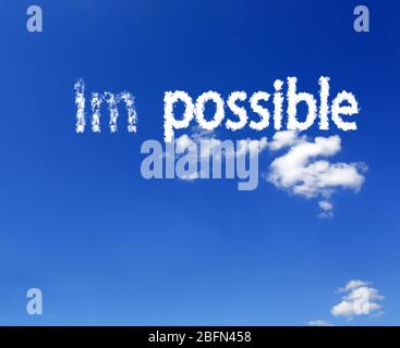 Word impossible transformed into possible on blue sky Stock Photo