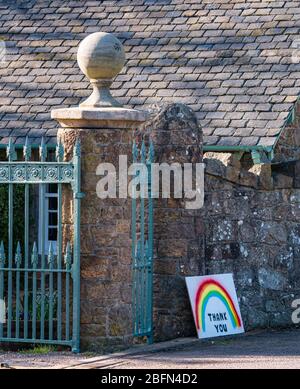 Rainbow drawing symbolising hope and thank you to NHS at entrance gate with gatehouse, East Lothian, Scotland, UK Stock Photo