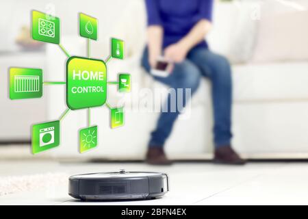 Using smart home app on phone. Smart home control concept. Stock Photo