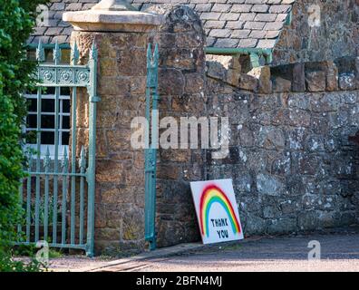 Rainbow drawing symbolising hope and thank you to NHS at entrance gate with gatehouse, East Lothian, Scotland, UK Stock Photo