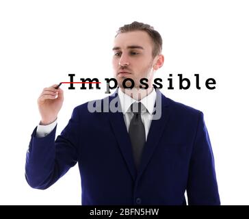 Human hand turning word impossible into possible Stock Photo