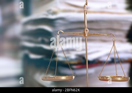 Justice scales on in library Stock Photo