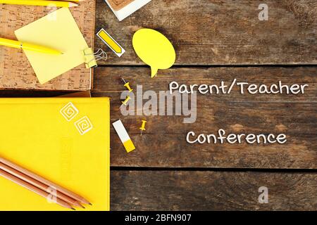 Stationary with text PARENT/TEACHER CONFERENCE on wooden background. School concept. Stock Photo