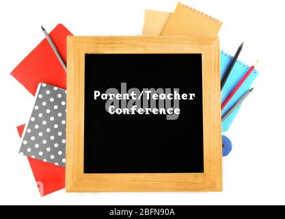 Blackboard with text PARENT/TEACHER CONFERENCE and stationery on white background. School concept. Stock Photo