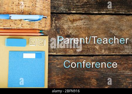 Stationary with text PARENT/TEACHER CONFERENCE on wooden background. School concept. Stock Photo