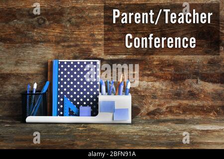 Stationary with text PARENT/TEACHER CONFERENCE on wooden background. School concept. Stock Photo