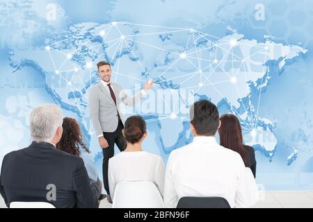 Business people having meeting at conference room. World map on background. Business concept. Stock Photo