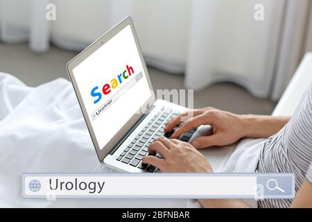Man searching information on internet, closeup. Word UROLOGY at search engine. Health care concept. Stock Photo