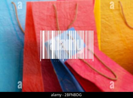 Barcode on blurred shopping bags background. Wholesale and retail concept. Stock Photo