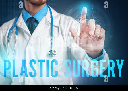 Man working with virtual screen. Plastic surgery concept Stock Photo