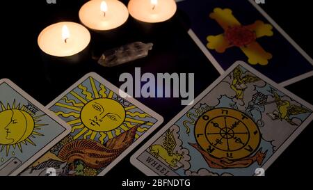 Tarot card reading. Christmas divination, ritual, rite. Magical crystal, candle. Predicting the future. Love spell. Witchcraft, magic. Stock Photo