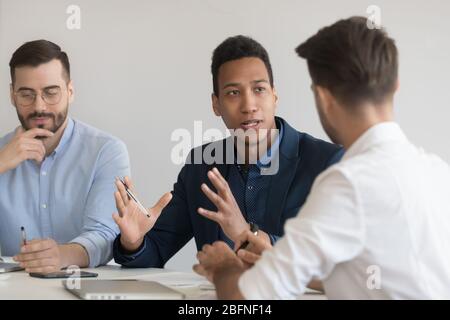 African team leader speaking during business meeting in office Stock Photo