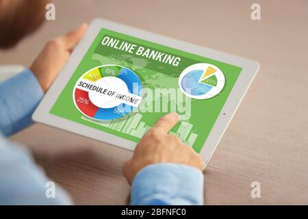 Online banking concept. Man using tablet Stock Photo