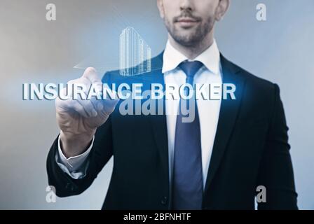 Insurance broker working with virtual screen Stock Photo