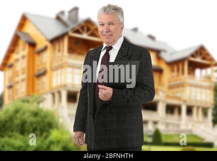 Insurance broker and building on background Stock Photo