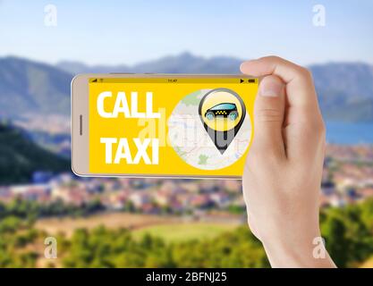 Man calling taxi service and cityscape on background Stock Photo
