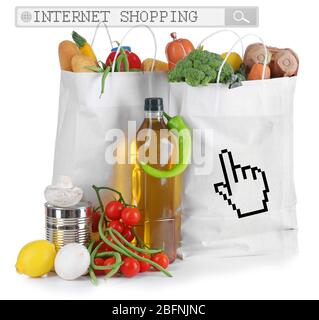 Paper bags with food on white background. Internet shopping concept Stock Photo