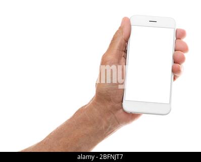 Elderly man holding mobile phone with blank screen on white background Stock Photo