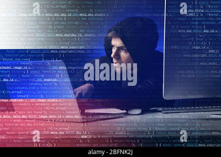 Man hacking computer password at table. Concept of cyber attack Stock Photo